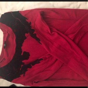 Red key hole sweater with black lace accent
